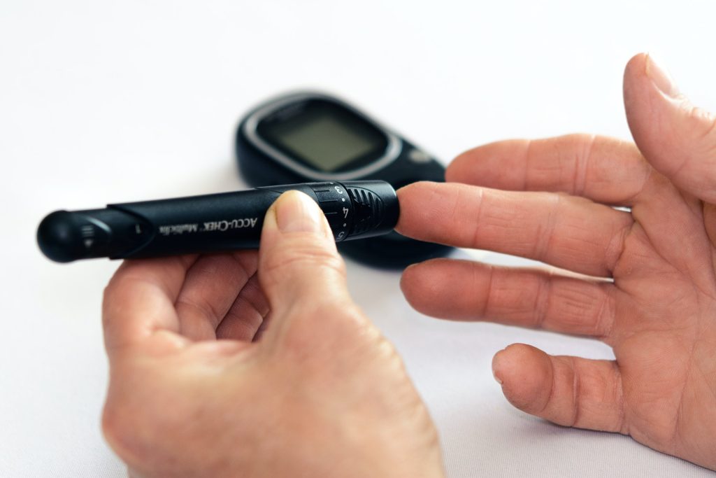 Diabetes - person measures blood glucose