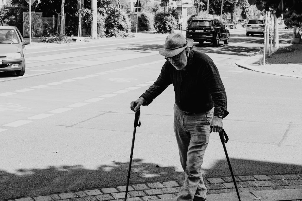 old man walking with canes